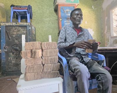 ‘It’s like we went bankrupt overnight’: poorest Somalis suffer as piles of worthless shillings mount up