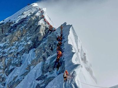 Mount Everest season opens late, with climbers undeterred by huge ice block and high travel costs
