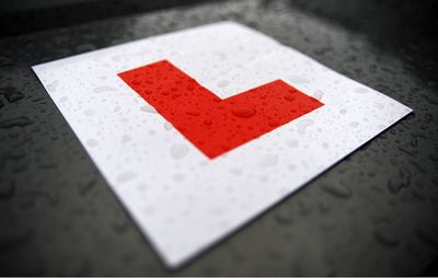 What are the new driving test booking rules aimed to curb scandalous profiteering?