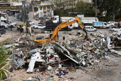 Israel demolishes dozens of Palestinian shops ahead of settlement-linked road project
