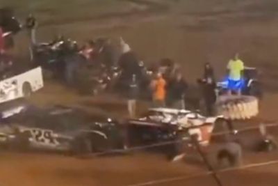 Driver arrested and banned after ramming car in the pits, knocking over crew members