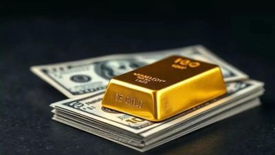 Gold edges up on weaker dollar ahead of Trump-Xi talks