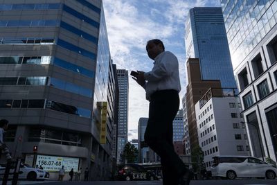 Japan's Nikkei touches record high on tech optimism; SoftBank, Topix slump