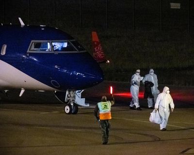 Australians from hantavirus cruise ship fly out of Netherlands in full PPE after plane and crew secured