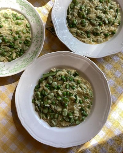 Rachel Roddy’s recipe for orzo with peas, broad beans, asparagus, parmesan and lemon