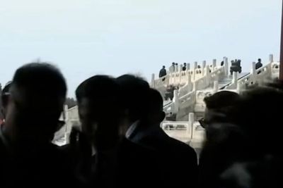 White House staffer ‘bruised and shaken’ after being knocked down and trampled by Chinese reporters, report says