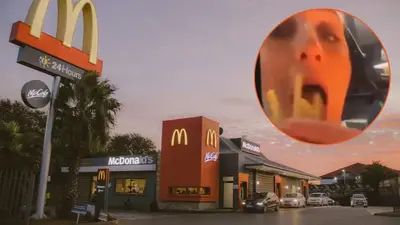 ‘She won’t be laughing in handcuffs’: Disgusting video shows McDonald’s employee in Massachusetts chewing fries before serving them