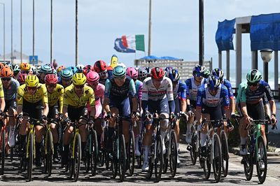 Crazy scenes at Giro d'Italia as lunging spectator menaces peloton - Video