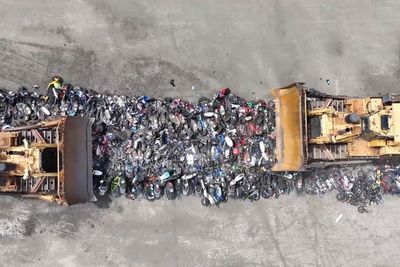 Police crush more than 200 motorcycles in crackdown on illegal vehicles