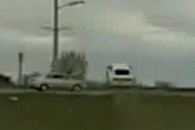 Wild moment speeding car flies over another vehicle while fleeing police