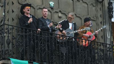 “The thunder and rain crashed the generator for the film shoot”: U2 film new video on top of a bus in a soaked Mexico City