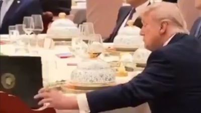 ‘He’s like an amateur spy’: Donald Trump appears to get caught snooping in Xi Jinping’s private notebook but it’s not what it looks like