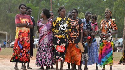 Next-generation Indigenous women flying employment flag