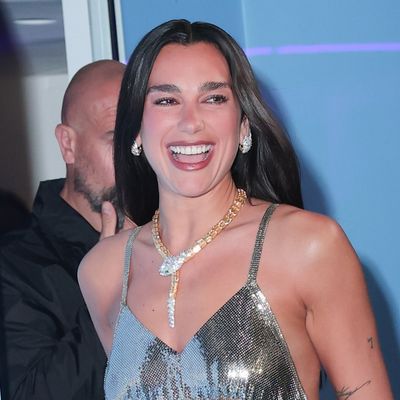 Dua Lipa Trades Her Vintage Versace Outfit for a Slinky Metallic Dress and the High-Vamp Trend