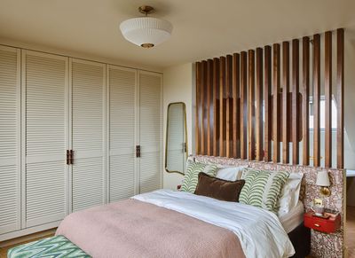 This Interior Designer Designed Her Art Deco Loft Conversion Bedroom With a Clever Open-Concept Bathroom and a Coffee Station Hidden in the Walls