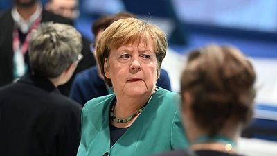 EU honours Merkel as her legacy on migration, Russia remains deeply divisive