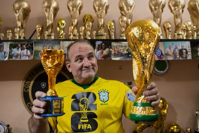 Brazilian artisan crafts replica World Cup trophies to the joy of locals and celebrities alike