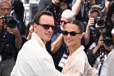 Michael Fassbender smiles alongside wife Alicia Vikander at Cannes