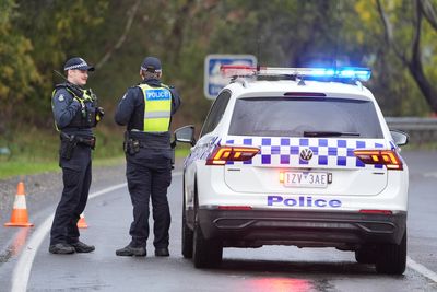 Man charged with murder of wife and two sons after calling police to their home in Australia