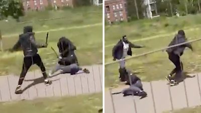 Moment hero stops thugs brawling with machetes in south London park in broad daylight