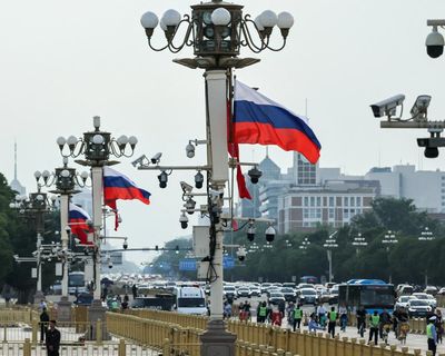 Vladimir Putin arrives in Beijing for state visit hot on heels of Trump