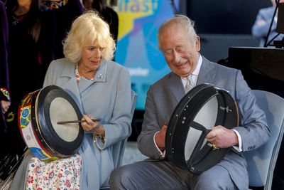 Charles and Camilla keep the beat on bodhran drums before sampling whiskey