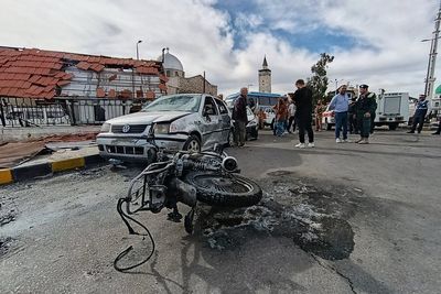 Blast outside a Syrian defense ministry building kills a soldier, wounds 12 people