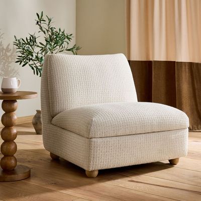 Next's stylish new armchair comes with clever hidden storage – it's a simple but genius solution to keep a small living room looking tidy