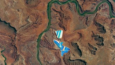 Bright-blue 'potash ponds' shine alongside a dark-green river in Utah — Earth from space