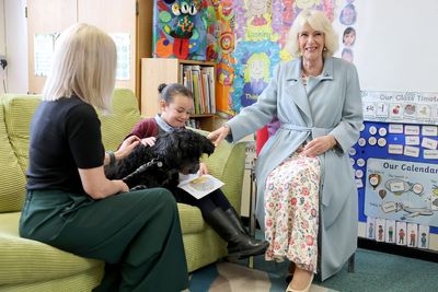 Queen meets therapy dog on visit to school in Northern Ireland