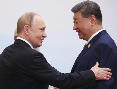 Putin lands in China for trip that aims to show unshakeable ties after Trump pomp