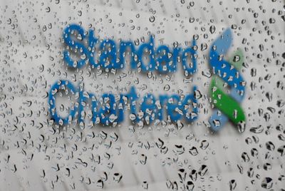 Standard ​Chartered to cut over 7,000 jobs as bank steps up AI adoption