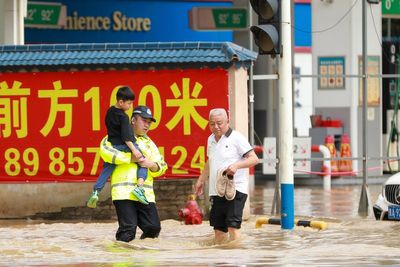 Torrential rain and floods batter China, killing at least 12 and forcing mass evacuations