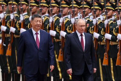 Xi Jinping and Vladimir Putin meet in Beijing to sign 47-page document