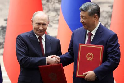 Xi warns world ‘risks returning to law of the jungle’ as he praises Putin at China talks