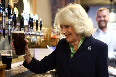 Queen Camilla pulls perfect Guinness pint during surprise pub visit