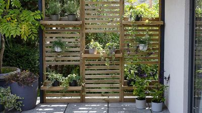 This 'Wooden Wall Planter' Adds a Garden Privacy Screen, Space for Potted Plants, and Way More Practicality to Your Outdoor Space, No Matter Its Size