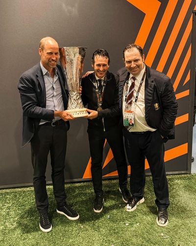 Prince William gets hands on Europa League trophy as he celebrates Aston Villa's historic win
