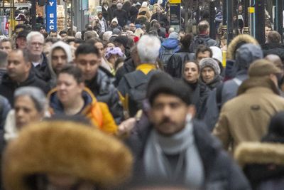 Net migration to UK slashed by nearly half driven by fewer people coming for work