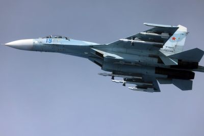 Video captures moment Russian jet flies just metres from RAF spy plane above Black Sea