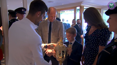 ‘Don't drop it,’ said Prince William as Novak Djokovic handed the 2022 Wimbledon trophy to Prince George