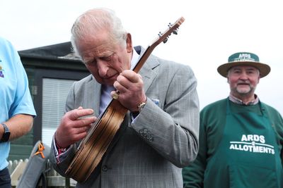 Charles shows plenty of pluck as he picks up ukulele on Northern Ireland visit