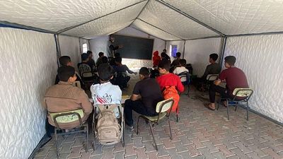 Gaza students sit exams in tents as nearly all schools lie in ruins