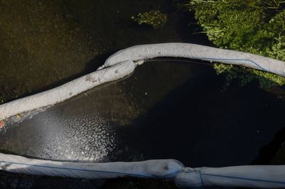 London river polluted by untreated waste flowing from homes