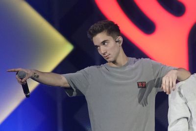 Ex-girlfriend of boy band member charged with trying to hire a hitman to kill him