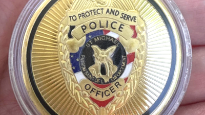 Utah woman discovers apparent police token with a chilling death threat on the back