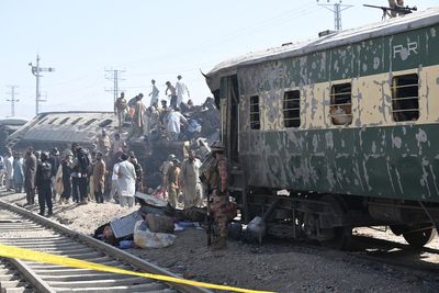 More than a dozen people dead as bomb blast in Pakistan overturns passenger train