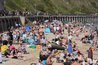 UK heatwave officially declared as temperatures top 32C on hottest day of the year so far