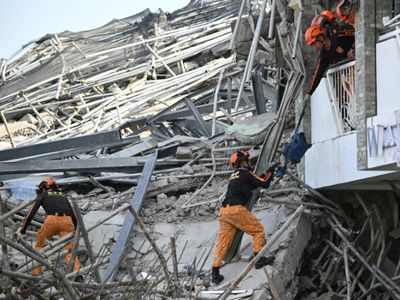 Rescuers search for 20 missing after Philippine building collapse
