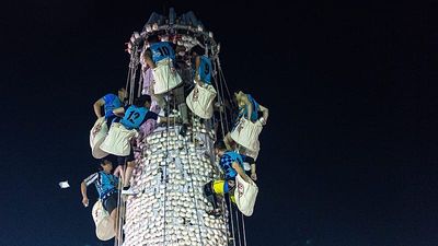 Climbers race up giant bun tower at Hong Kong’s colourful Bun Festival